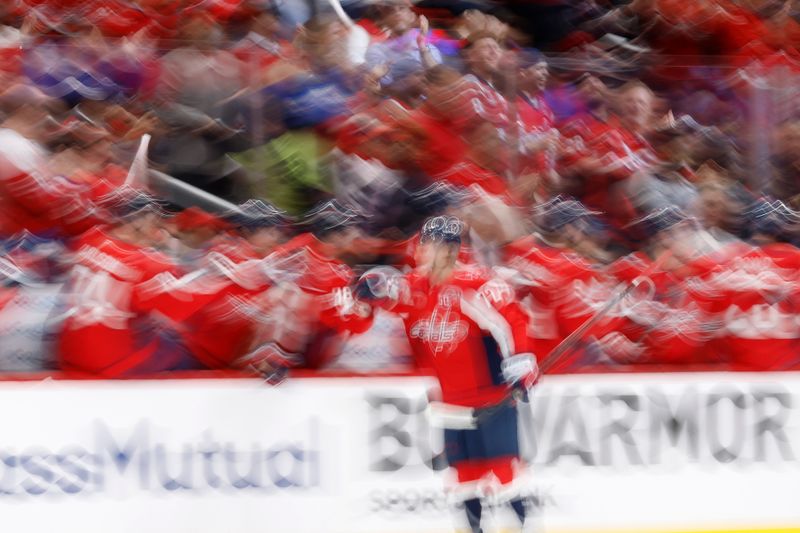 Apr 21, 2025; Washington, District of Columbia, USA; Washington Capitals left wing Anthony Beauvillier (72) celebrates with teammates after scoring a goal against the Montreal Canadiens in the second period in game one of the first round of the 2025 Stanley Cup Playoffs at Capital One Arena. Mandatory Credit: Geoff Burke-Imagn Images