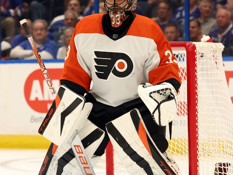 Mar 9, 2024; Tampa, Florida, USA; Philadelphia Flyers goaltender Samuel Ersson (33) looks on against the Tampa Bay Lightning during the first period at Amalie Arena. Mandatory Credit: Kim Klement Neitzel-USA TODAY Sports