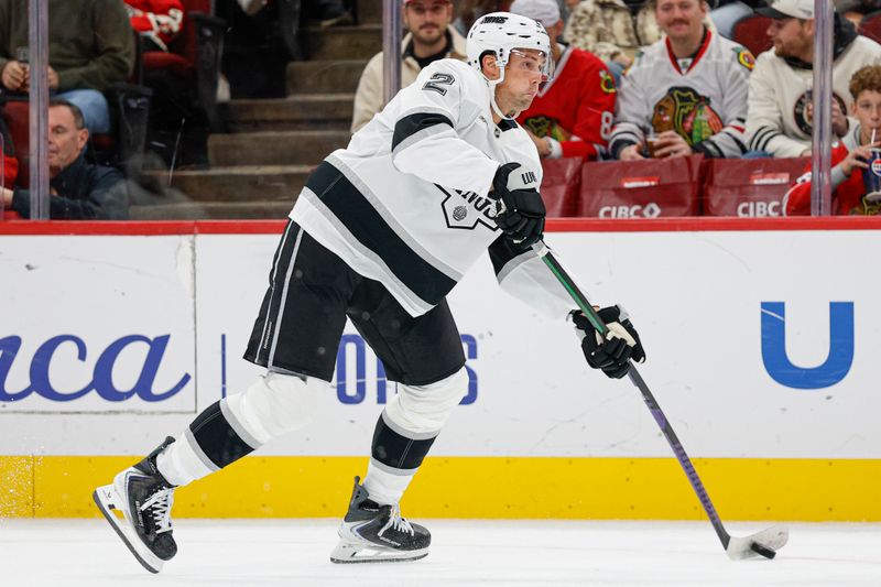 Oct 26, 2025; Chicago, Illinois, USA; Los Angeles Kings defenseman Brian Dumoulin (2) looks to pass the puck against the Chicago Blackhawks during the first period at United Center. Mandatory Credit: Kamil Krzaczynski-Imagn Images