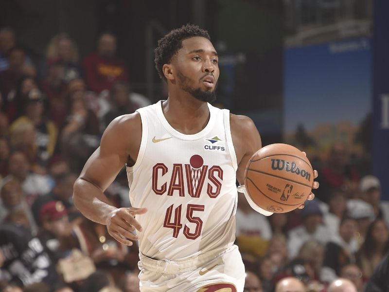 CLEVELAND, OH - OCTOBER 25: Donovan Mitchell #45 of the Cleveland Cavaliers looks to pass the ball during the game against the Detroit Pistons on October 25, 2024 at Rocket Mortgage FieldHouse in Cleveland, Ohio. NOTE TO USER: User expressly acknowledges and agrees that, by downloading and/or using this Photograph, user is consenting to the terms and conditions of the Getty Images License Agreement. Mandatory Copyright Notice: Copyright 2024 NBAE (Photo by David Liam Kyle/NBAE via Getty Images)