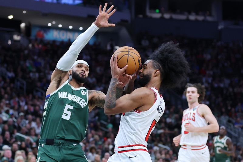 MILWAUKEE, WISCONSIN - OCTOBER 25: Coby White #0 of the Chicago Bulls is defended by Gary Trent Jr. #5 of the Milwaukee Bucks during the first half of a game at Fiserv Forum on October 25, 2024 in Milwaukee, Wisconsin. NOTE TO USER: User expressly acknowledges and agrees that, by downloading and or using this photograph, User is consenting to the terms and conditions of the Getty Images License Agreement. (Photo by Stacy Revere/Getty Images)