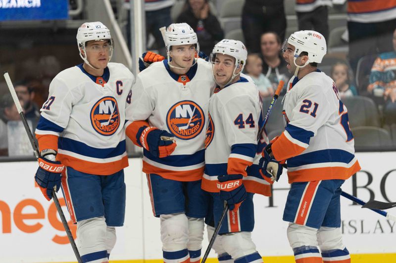 Mar 7, 2024; San Jose, California, USA; (L to R) New York Islanders left wing Anders Lee (27) , defenseman Noah Dobson (8) , center Jean-Gabriel Pageau (44) and center Kyle Palmieri (21) celebrate during the first period against the San Jose Sharks at SAP Center at San Jose. Mandatory Credit: Stan Szeto-USA TODAY Sports