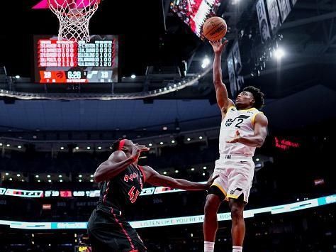 TORONTO, ON - DECEMBER 23: Collin Sexton #2 of the Utah Jazz goes to the basket against Pascal Siakam #43 of the Toronto Raptors during the first half of their basketball game at the Scotiabank Arena on December 23, 2023 in Toronto, Ontario, Canada. NOTE TO USER: User expressly acknowledges and agrees that, by downloading and/or using this Photograph, user is consenting to the terms and conditions of the Getty Images License Agreement. (Photo by Mark Blinch/Getty Images)