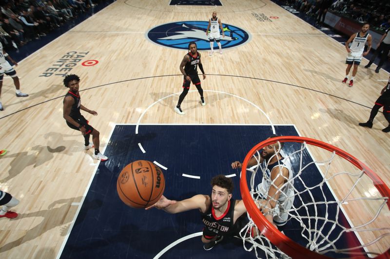 MINNEAPOLIS, MN -  FEBRUARY 4: Alperen Sengun #28 of the Houston Rockets grabs a rebound during the game against the Minnesota Timberwolves on February 4, 2024 at Target Center in Minneapolis, Minnesota. NOTE TO USER: User expressly acknowledges and agrees that, by downloading and or using this Photograph, user is consenting to the terms and conditions of the Getty Images License Agreement. Mandatory Copyright Notice: Copyright 2024 NBAE (Photo by Jordan Johnson/NBAE via Getty Images)