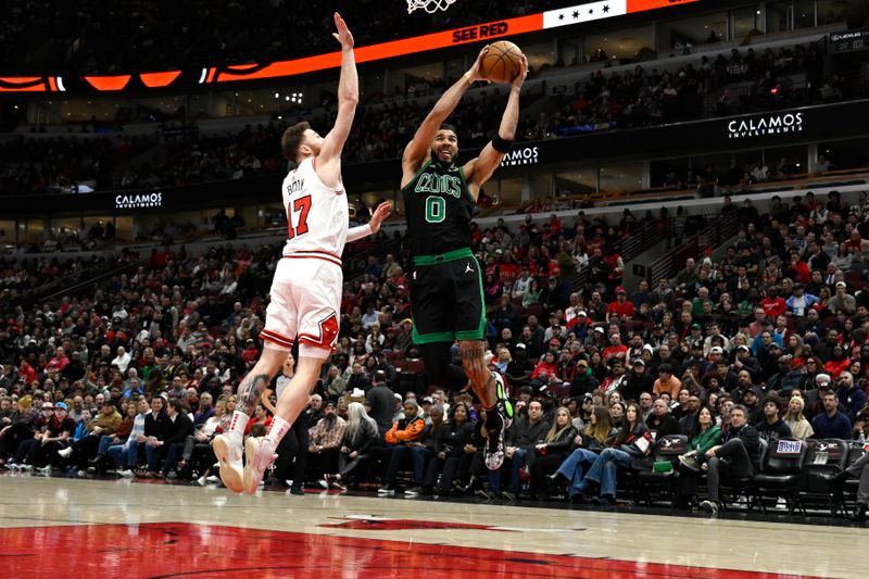 CHICAGO, ILLINOIS - MARCH 23: Jayson Tatum #0 of the Boston Celtics shoots in the first half against Onuralp Bitim #17 of the Chicago Bulls at the United Center on March 23, 2024 in Chicago, Illinois.   NOTE TO USER: User expressly acknowledges and agrees that, by downloading and or using this photograph, User is consenting to the terms and conditions of the Getty Images License Agreement.  (Photo by Quinn Harris/Getty Images)