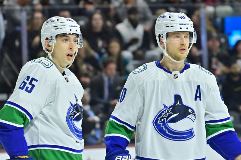 Apr 3, 2024; Tempe, Arizona, USA; Vancouver Canucks right wing Ilya Mikheyev (65) and center Elias Pettersson (40) look on in the second period against the Arizona Coyotes at Mullett Arena. Mandatory Credit: Matt Kartozian-USA TODAY Sports