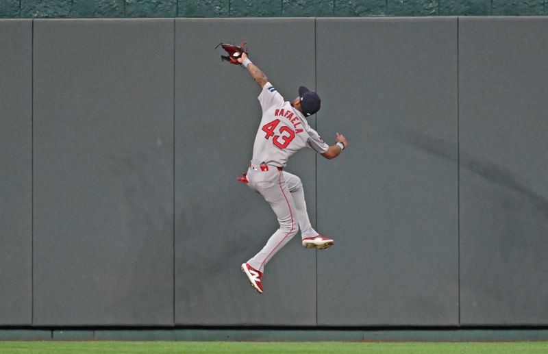 Aug 5, 2024; Kansas City, Missouri, USA;  Boston Red Sox center fielder Ceddanne Rafaela (43) catches a fly ball in front of the center field wall against Kansas City Royals Maikel Garcia (not pictured) in the fifth inning at Kauffman Stadium. Mandatory Credit: Peter Aiken-USA TODAY Sports