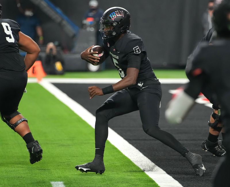 Nov 19, 2021; Paradise, Nevada, USA; UNLV Rebels quarterback Justin Rogers (5) rushes the ball out of his own end zone during a game against the San Diego State Aztecs at Allegiant Stadium. Mandatory Credit: Stephen R. Sylvanie-USA TODAY Sports