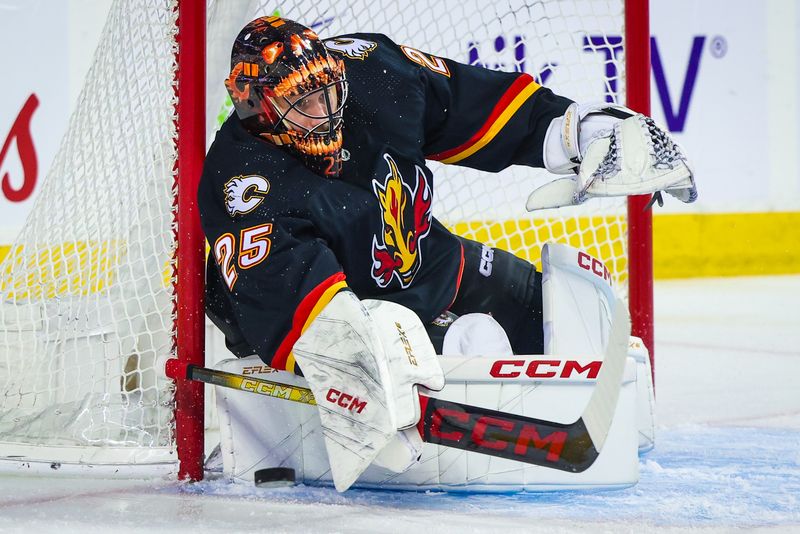 Jan 23, 2024; Calgary, Alberta, CAN; Calgary Flames goaltender Jacob Markstrom (25) makes a save against the St. Louis Blues during the first period at Scotiabank Saddledome. Mandatory Credit: Sergei Belski-USA TODAY Sports