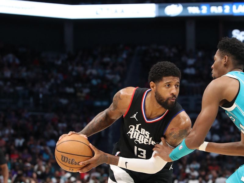 CHARLOTTE, NC - MARCH 31: Paul George #13 of the LA Clippers looks to pass the ball during the game against the Charlotte Hornets on March 31, 2024 at Spectrum Center in Charlotte, North Carolina. NOTE TO USER: User expressly acknowledges and agrees that, by downloading and or using this photograph, User is consenting to the terms and conditions of the Getty Images License Agreement.  Mandatory Copyright Notice:  Copyright 2024 NBAE (Photo by Brock Williams-Smith/NBAE via Getty Images)