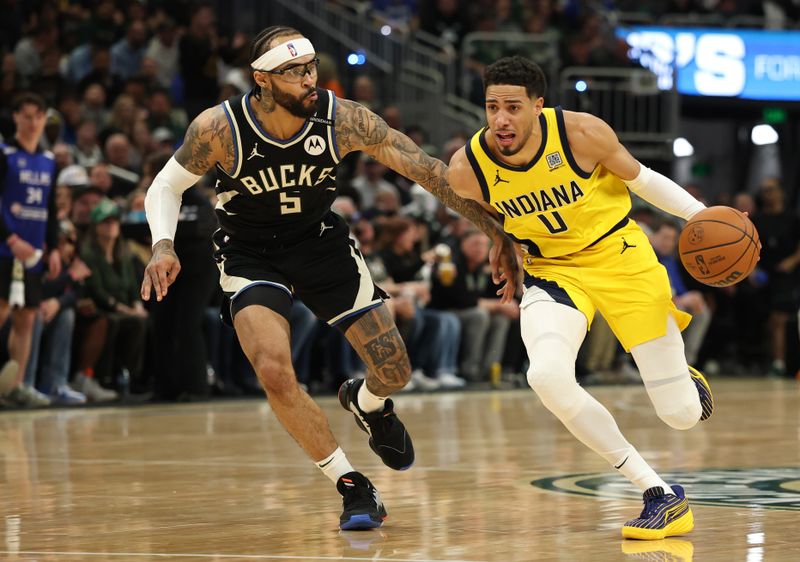 MILWAUKEE, WISCONSIN - APRIL 27: Tyrese Haliburton #0 of the Indiana Pacers drives to the basket against Gary Trent Jr. #5 of the Milwaukee Bucks during the first quarter in Game Four of the Eastern Conference First Round NBA Playoffs at Fiserv Forum on April 27, 2025 in Milwaukee, Wisconsin. NOTE TO USER: User expressly acknowledges and agrees that, by downloading and or using this photograph, User is consenting to the terms and conditions of the Getty Images License Agreement. (Photo by Stacy Revere/Getty Images)