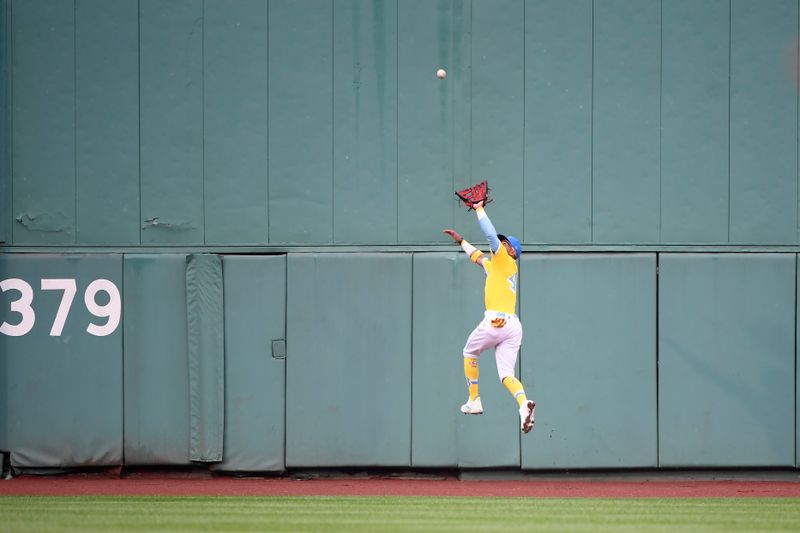 Sep 10, 2023; Boston, Massachusetts, USA;  Boston Red Sox center fielder Ceddanne Rafaela (43) jumps to make a catch during the third inning against the Baltimore Orioles at Fenway Park. Mandatory Credit: Bob DeChiara-USA TODAY Sports