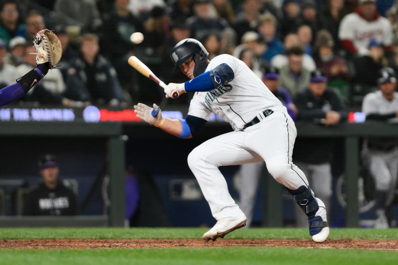 Apr 15, 2023; Seattle, Washington, USA; Seattle Mariners first baseman Ty France (23) ducks under a pitch during the eighth inning against the Colorado Rockies at T-Mobile Park. Mandatory Credit: Steven Bisig-USA TODAY Sports