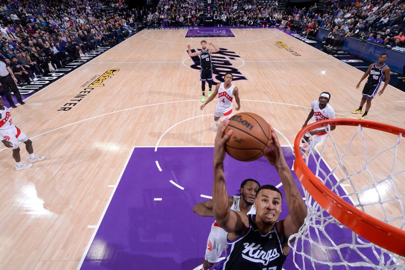 SACRAMENTO, CA - JANUARY 5: Keegan Murray #13 of the Sacramento Kings drives to the basket during the game against the Toronto Raptors on January 5, 2024 at Golden 1 Center in Sacramento, California. NOTE TO USER: User expressly acknowledges and agrees that, by downloading and or using this Photograph, user is consenting to the terms and conditions of the Getty Images License Agreement. Mandatory Copyright Notice: Copyright 2024 NBAE (Photo by Rocky Widner/NBAE via Getty Images)