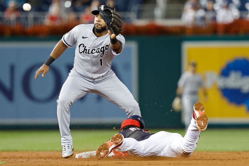 Sep 18, 2023; Washington, District of Columbia, USA; Washington Nationals shortstop CJ Abrams (5) steals second base ahead of a tag by Chicago White Sox shortstop Elvis Andrus (1) during the third inning at Nationals Park. Mandatory Credit: Geoff Burke-USA TODAY Sports