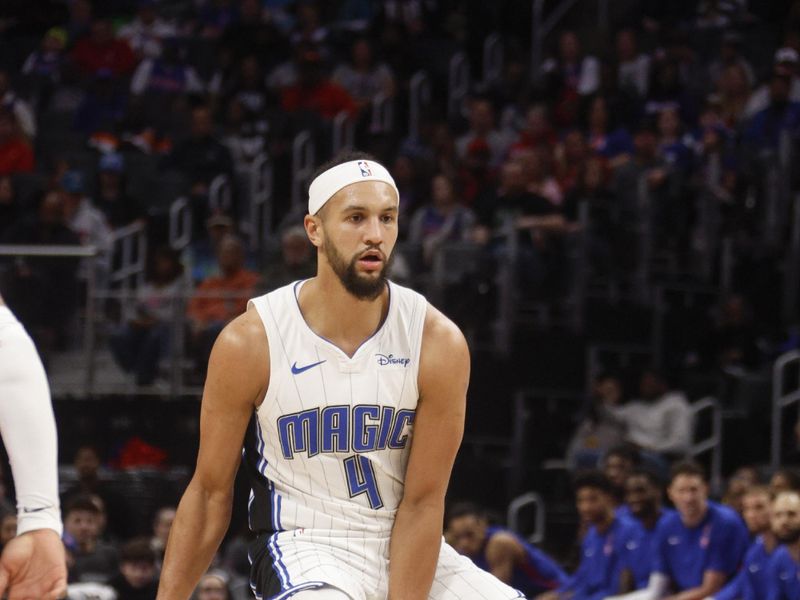 DETROIT, MI - FEBRUARY 24:  Jalen Suggs #4 of the Orlando Magic handles the ball during the game  on February 24, 2024 at Little Caesars Arena in Detroit, Michigan. NOTE TO USER: User expressly acknowledges and agrees that, by downloading and/or using this photograph, User is consenting to the terms and conditions of the Getty Images License Agreement. Mandatory Copyright Notice: Copyright 2024 NBAE (Photo by Brian Sevald/NBAE via Getty Images)