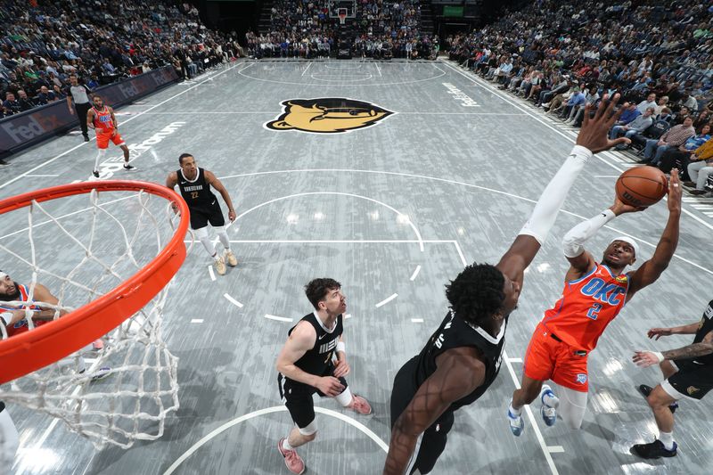 MEMPHIS, TN - MARCH 16:  Shai Gilgeous-Alexander #2 of the Oklahoma City Thunder shoots the ball during the game against the Memphis Grizzlies on March 16, 2024 at FedExForum in Memphis, Tennessee. NOTE TO USER: User expressly acknowledges and agrees that, by downloading and or using this photograph, User is consenting to the terms and conditions of the Getty Images License Agreement. Mandatory Copyright Notice: Copyright 2024 NBAE (Photo by Joe Murphy/NBAE via Getty Images)