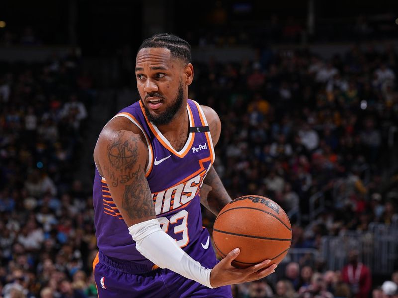 DENVER, CO - OCTOBER 13: Monte Morris #23 of the Phoenix Suns drives to the basket during the game against the Denver Nuggets on October 13, 2024 at Ball Arena in Denver, Colorado. NOTE TO USER: User expressly acknowledges and agrees that, by downloading and/or using this Photograph, user is consenting to the terms and conditions of the Getty Images License Agreement. Mandatory Copyright Notice: Copyright 2024 NBAE (Photo by Garrett Ellwood/NBAE via Getty Images)