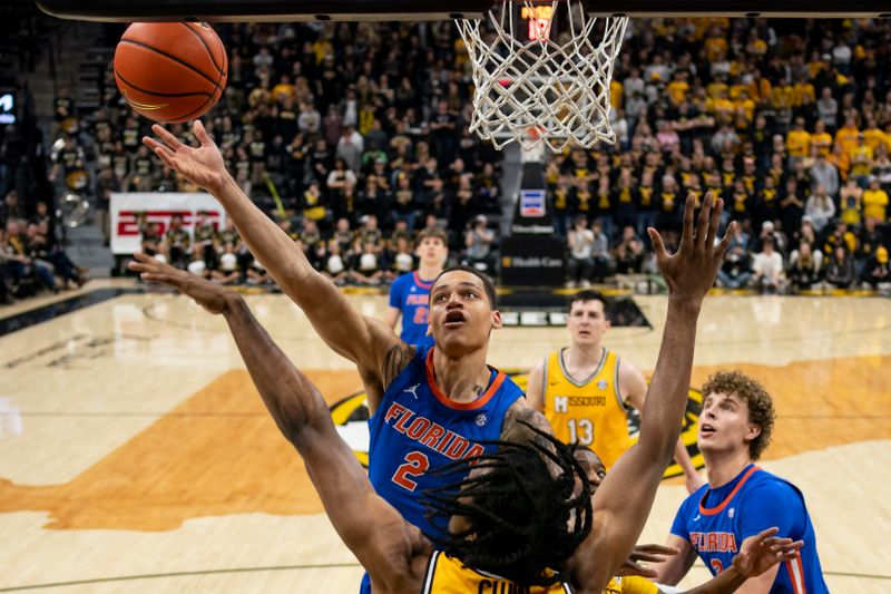 Jan 20, 2024; Columbia, Missouri, USA; Florida Gators guard Riley Kugel (2) shoots against Missouri Tigers forward Aidan Shaw (23) during the first half at Mizzou Arena. Mandatory Credit: Jay Biggerstaff-USA TODAY Sports