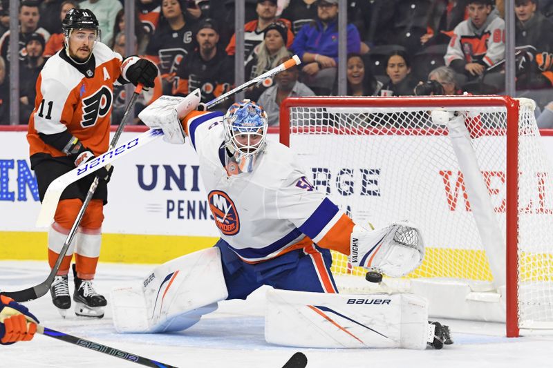 Sep 26, 2024; Philadelphia, Pennsylvania, USA; New York Islanders goaltender Marcus Hogberg (50) makes a save against the Philadelphia Flyers during the second period at Wells Fargo Center. Mandatory Credit: Eric Hartline-Imagn Images