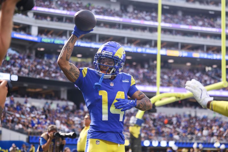 Los Angeles Rams cornerback Cobie Durant (14) celebrates his interception during the first half of an NFL football game against the Las Vegas Raiders, Sunday, Oct. 20, 2024, in Inglewood, Calif. (AP Photo/Ryan Sun)