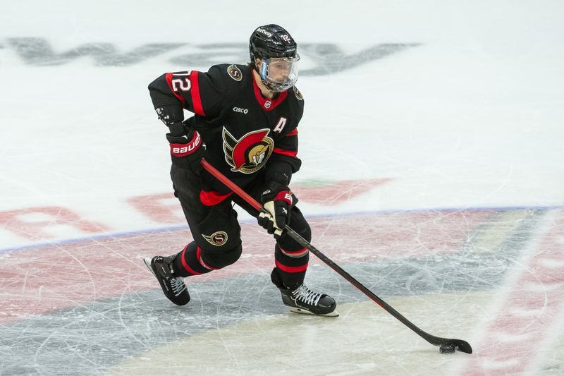 Jan 26, 2025; Ottawa, Ontario, CAN; Ottawa Senators defenseman Thomas Chabot (72) skates with the puck in the third period against Utah in their game at the Canadian Tire Centre. Mandatory Credit: Marc DesRosiers-Imagn Images