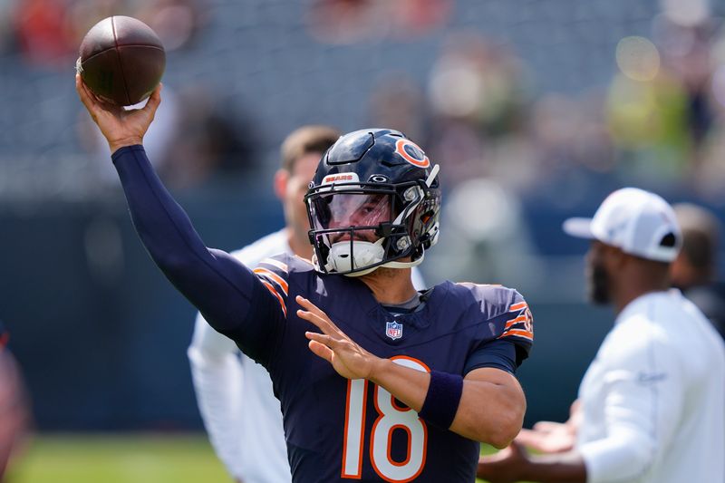 Chicago Bears quarterback Caleb Williams (18) throws the ball before the start of an NFL preseason football game against the Cincinnati Bengals, Saturday, Aug. 17, 2024, at Soldier Field in Chicago. (AP Photo/Charles Rex Arbogast)