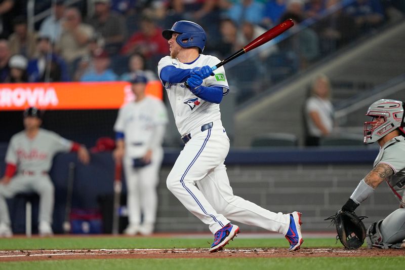 Jun 5, 2025; Toronto, Ontario, CAN; Toronto Blue Jays center fielder Myles Straw (3) hits an RBI double against the Philadelphia Phillies during the second inning at Rogers Centre. Mandatory Credit: John E. Sokolowski-Imagn Images