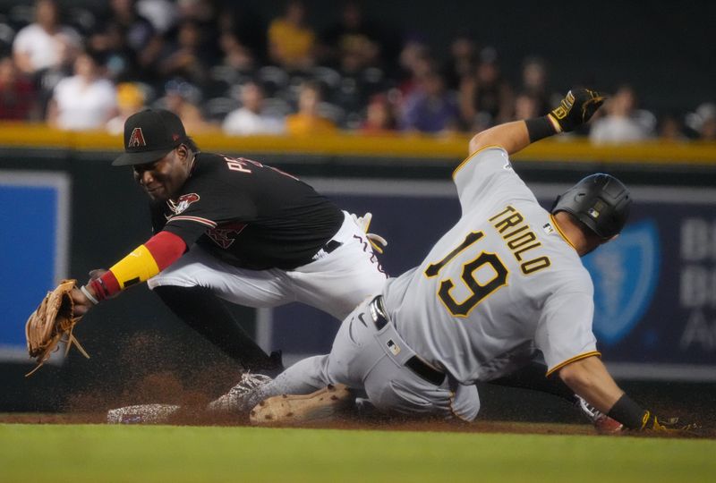 Jul 9, 2023; Phoenix, Arizona, USA;  Arizona Diamondbacks infielder Geraldo Perdomo (2) catches the ball for a force out at second base against Pittsburgh Pirates Jared Triolo (19) at Chase Field. Mandatory Credit: Joe Rondone-USA TODAY Sports