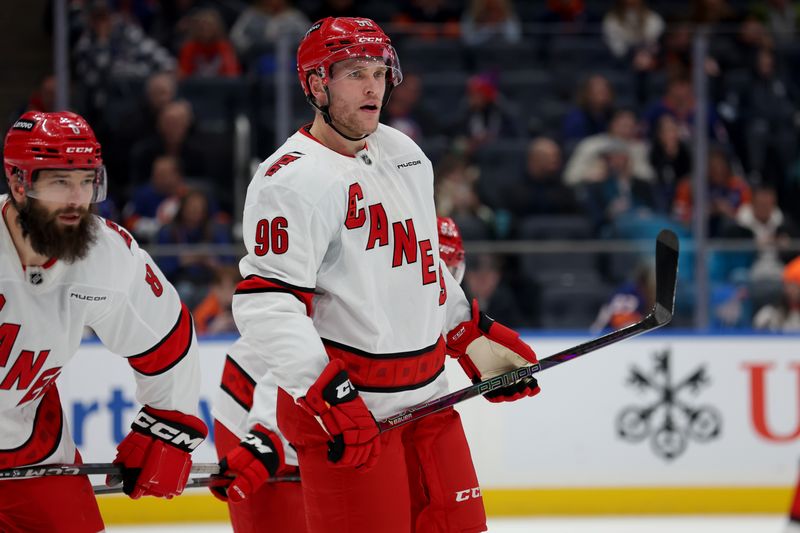 Jan 25, 2025; Elmont, New York, USA; Carolina Hurricanes right wing Mikko Rantanen (96) skates against the New York Islanders during the first period at UBS Arena. Mandatory Credit: Brad Penner-Imagn Images