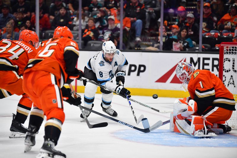 Oct 16, 2024; Anaheim, California, USA; Utah Hockey Club center Nick Schmaltz (8) shoots on goal against Anaheim Ducks goaltender Lukas Dostal (1) during the first period at Honda Center. Mandatory Credit: Gary A. Vasquez-Imagn Images