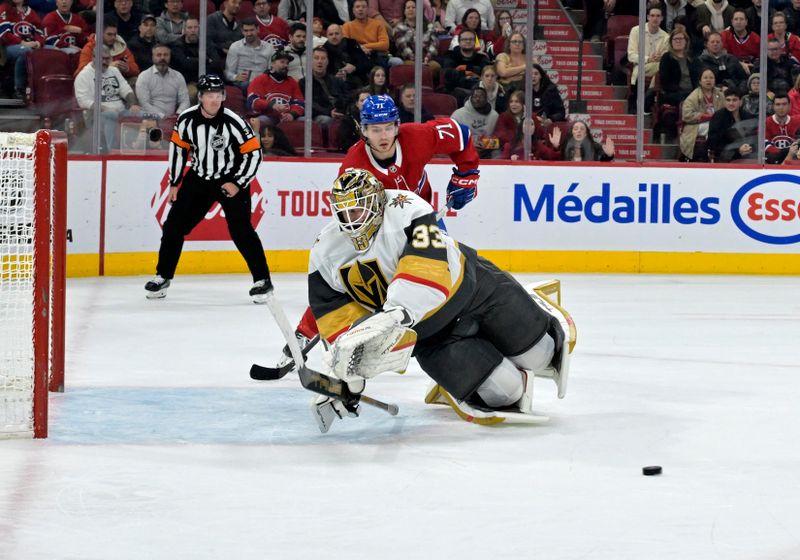 Nov 16, 2023; Montreal, Quebec, CAN; Vegas Golden Knights goalie Adin Hill (33) dives for the puck during the second period of the game against the Montreal Canadiens at the Bell Centre. Mandatory Credit: Eric Bolte-USA TODAY Sports