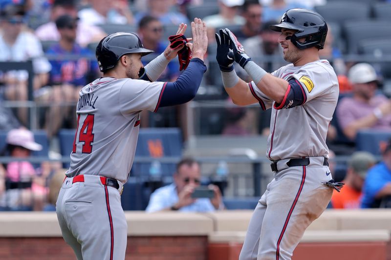 Jul 28, 2024; New York City, New York, USA; Atlanta Braves third baseman Austin Riley (27) celebrates his two run home run against the New York Mets with second baseman Nacho Alvarez Jr. (17) during the seventh inning at Citi Field. Mandatory Credit: Brad Penner-USA TODAY Sports