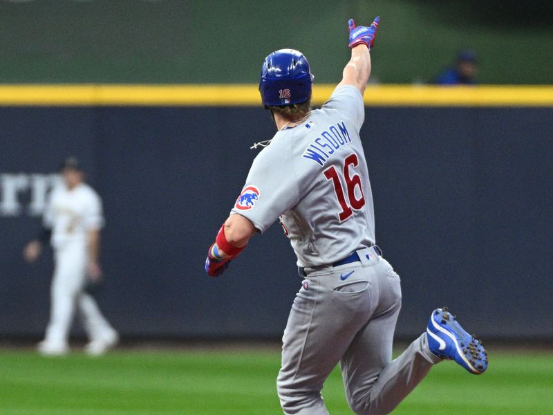 Sep 30, 2023; Milwaukee, Wisconsin, USA; Chicago Cubs third baseman Patrick Wisdom (16) celebrates hitting a home run against the Milwaukee Brewers in the first inning at American Family Field. Mandatory Credit: Michael McLoone-USA TODAY Sports