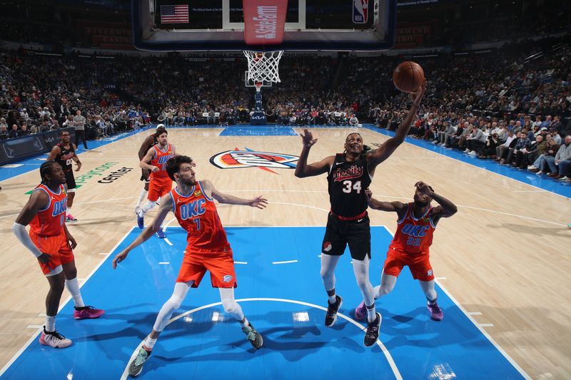 OKLAHOMA CITY, OK - JANUARY 23: Jabari Walker #34 of the Portland Trail Blazers grabs the rebound during the game against the Oklahoma City Thunder on January 23, 2024 at Paycom Arena in Oklahoma City, Oklahoma. NOTE TO USER: User expressly acknowledges and agrees that, by downloading and or using this photograph, User is consenting to the terms and conditions of the Getty Images License Agreement. Mandatory Copyright Notice: Copyright 2024 NBAE (Photo by Zach Beeker/NBAE via Getty Images)