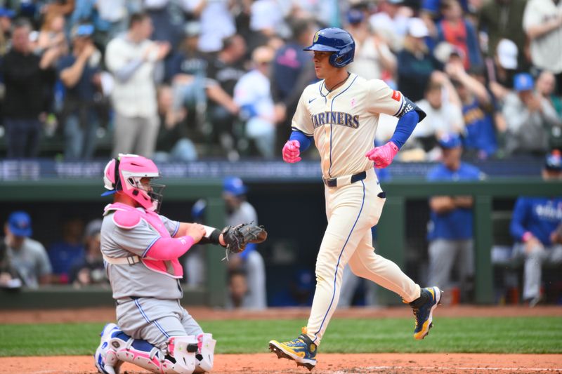 May 11, 2025; Seattle, Washington, USA; Seattle Mariners second baseman Dylan Moore (25) runs the bases after hitting a home run against the Toronto Blue Jays during the third inning at T-Mobile Park. Mandatory Credit: Steven Bisig-Imagn Images