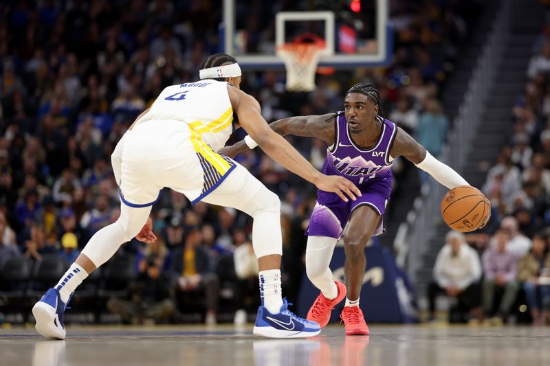 SAN FRANCISCO, CALIFORNIA - APRIL 14: Kira Lewis Jr. #13 of the Utah Jazz is guarded by Moses Moody #4 of the Golden State Warriors in the second half at Chase Center on April 14, 2024 in San Francisco, California. NOTE TO USER: User expressly acknowledges and agrees that, by downloading and or using this photograph, User is consenting to the terms and conditions of the Getty Images License Agreement.  (Photo by Ezra Shaw/Getty Images)