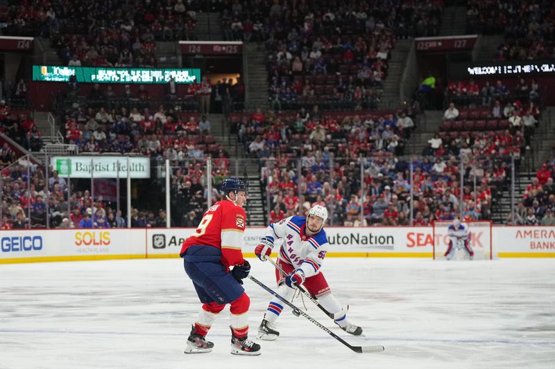 Dec 29, 2023; Sunrise, Florida, USA; New York Rangers defenseman Ryan Lindgren (55) passes the puck around Florida Panthers left wing Matthew Tkachuk (19) during the first period at Amerant Bank Arena. Mandatory Credit: Jasen Vinlove-USA TODAY Sports