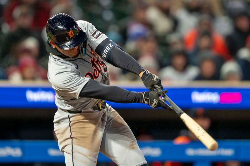 Apr 19, 2024; Minneapolis, Minnesota, USA; Detroit Tigers right fielder Wenceel Perez (46) hits a RBI single against the Minnesota Twins in the ninth inning at Target Field. Mandatory Credit: Jesse Johnson-USA TODAY Sports