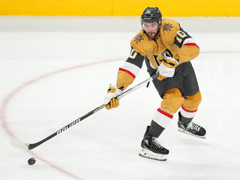 Feb 18, 2023; Las Vegas, Nevada, USA; Vegas Golden Knights center Nicolas Roy (10) makes a pass against the Tampa Bay Lightning during the third period at T-Mobile Arena. Mandatory Credit: Stephen R. Sylvanie-USA TODAY Sports