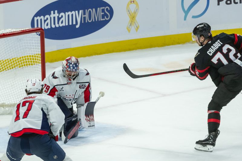 Jan 30, 2025; Ottawa, Ontario, CAN; Ottawa Senators defenseman Thomas Chabot (72) scores against Washington Capitals goalie Charlie Lindgren (79) in overtime at the Canadian Tire Centre. Mandatory Credit: Marc DesRosiers-Imagn Images