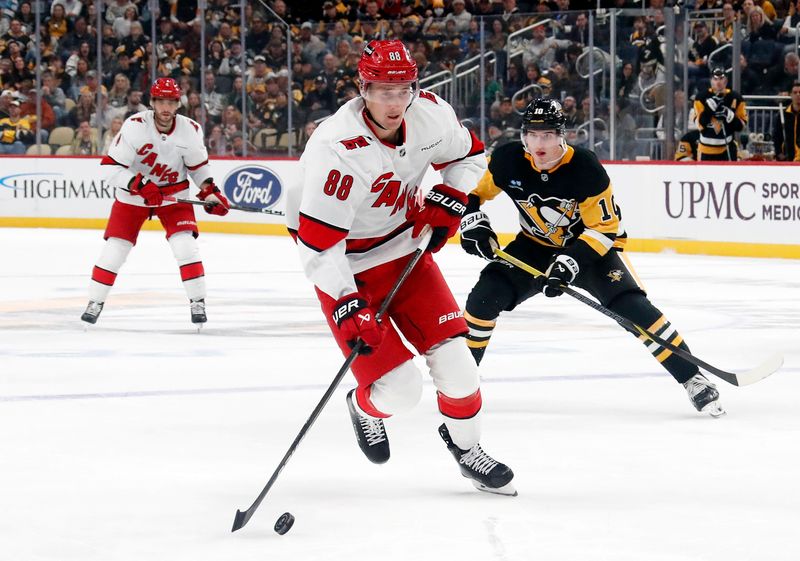 Oct 18, 2024; Pittsburgh, Pennsylvania, USA;  Carolina Hurricanes center Martin Necas (88) carries the puck against the Pittsburgh Penguins during the second period at PPG Paints Arena. Mandatory Credit: Charles LeClaire-Imagn Images