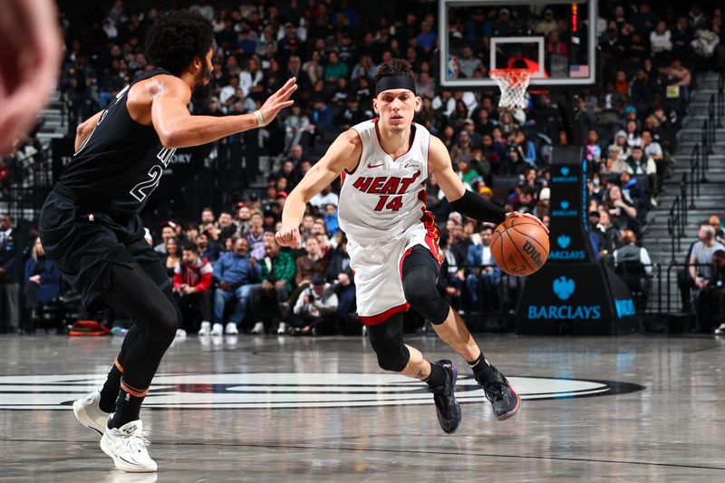 BROOKLYN, NY - JANUARY 15: Tyler Herro #14 of the Miami Heat drives to the basket during the game against the Brooklyn Nets on January 15, 2024 at Barclays Center in Brooklyn, New York. NOTE TO USER: User expressly acknowledges and agrees that, by downloading and or using this Photograph, user is consenting to the terms and conditions of the Getty Images License Agreement. Mandatory Copyright Notice: Copyright 2024 NBAE (Photo by David Nemec/NBAE via Getty Images)