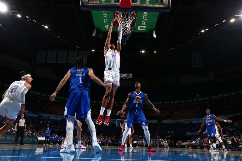 OKLAHOMA CITY, OK - OCTOBER 9: Ousmane Dieng #13 of the Oklahoma City Thunder drives to the basket during the game against  on October 9, 2022 at Paycom Arena in Oklahoma City, Oklahoma. NOTE TO USER: User expressly acknowledges and agrees that, by downloading and or using this photograph, User is consenting to the terms and conditions of the Getty Images License Agreement. Mandatory Copyright Notice: Copyright 2022 NBAE (Photo by Zach Beeker/NBAE via Getty Images)