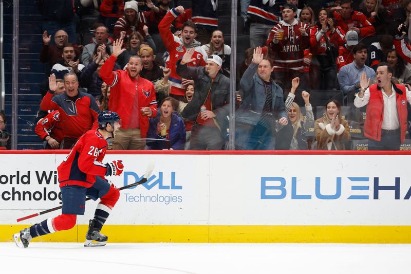 Jan 5, 2024; Washington, District of Columbia, USA; Washington Capitals right wing Nic Dowd (26) celebrates after scoring a goal against the Carolina Hurricanes in the first period at Capital One Arena. Mandatory Credit: Geoff Burke-USA TODAY Sports