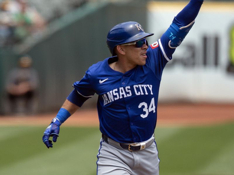 Jun 20, 2024; Oakland, California, USA; Kansas City Royals designated hitter Freddy Fermin (34) celebrates his solo home run against the Oakland Athletics during the second inning at Oakland-Alameda County Coliseum. Mandatory Credit: D. Ross Cameron-USA TODAY Sports