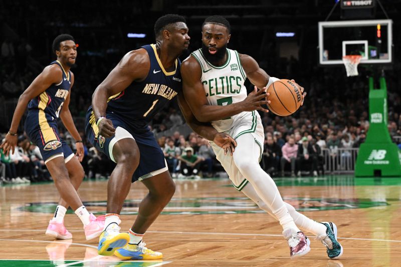 BOSTON, MASSACHUSETTS - JANUARY 29: Jaylen Brown #7 of the Boston Celtics drives to the basket against Zion Williamson #1 of the New Orleans Pelicans during the first quarter at the TD Garden on January 29, 2024 in Boston, Massachusetts. NOTE TO USER: User expressly acknowledges and agrees that, by downloading and or using this photograph, User is consenting to the terms and conditions of the Getty Images License Agreement. (Photo by Brian Fluharty/Getty Images)