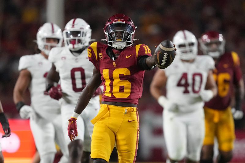 Sep 9, 2023; Los Angeles, California, USA; Southern California Trojans wide receiver Tahj Washington (16) gestures after a first down against the Stanford Cardinal in the first half at United Airlines Field at Los Angeles Memorial Coliseum. Mandatory Credit: Kirby Lee-USA TODAY Sports