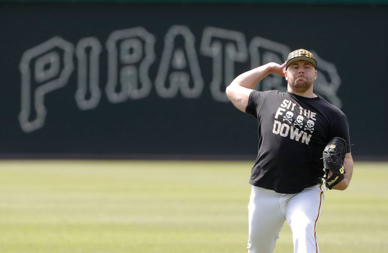 May 23, 2024; Pittsburgh, Pennsylvania, USA; Pittsburgh Pirates relief pitcher David Bednar (51) throws in the outfield before the game against the San Francisco Giants  at PNC Park. Mandatory Credit: Charles LeClaire-USA TODAY Sports