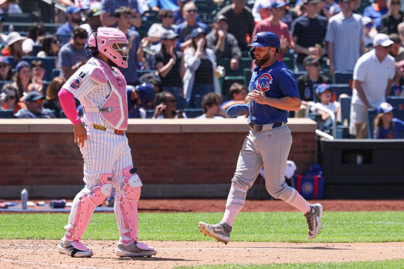 May 11, 2025; New York City, New York, USA; Chicago Cubs first baseman Michael Busch (29) scores a run during the seventh inning against the New York Mets at Citi Field. Mandatory Credit: Vincent Carchietta-Imagn Images